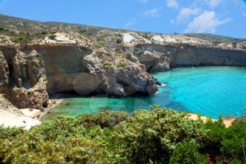 Beautiful turquoise water at Tsigrado beach in Milos island in Greece