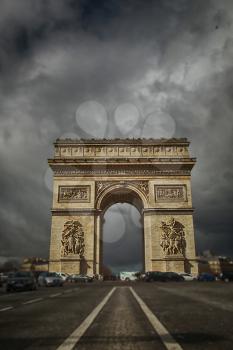 Arc the Triomphe with a grey and cloudy sky in Paris, France