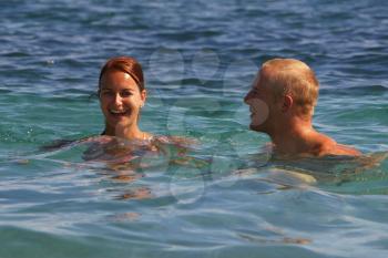 Royalty Free Photo of a Couple Swimming