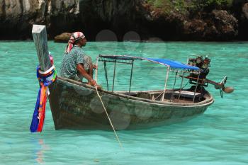 Royalty Free Photo of a Man on a Boat