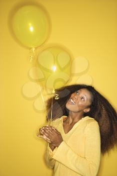 Royalty Free Photo of a Woman Holding Balloons
