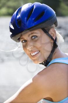 Royalty Free Photo of a Woman Wearing a Bicycle Helmet and Smiling