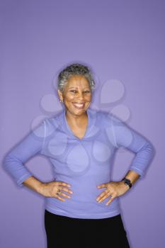 Royalty Free Photo of a Mature Adult Female Standing Smiling