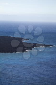 Royalty Free Photo of an Aerial of Lava Rock Coastline Jutting into Pacific Ocean on Maui, Hawaii