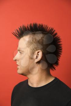 Royalty Free Photo of a Profile of a Man With a Spiked Mohawk