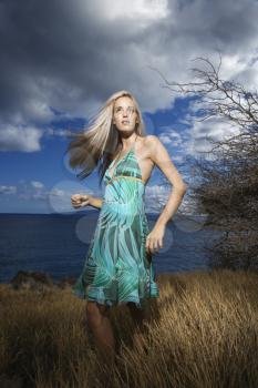 Royalty Free Photo of a Blond Woman Standing in a Field