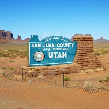 Welcome sign in desert for San Juan County in Monument Valley, Utah. 