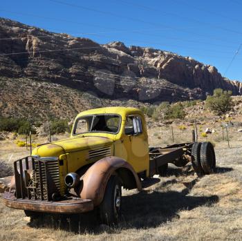 Royalty Free Photo of an Old Abandoned Truck in a Desert Landscape of Utah