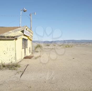 Royalty Free Photo of an Old Trading Post in a Desert Landscape of Utah