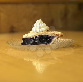 Royalty Free Photo of a Slice of Blueberry Pie on a Plate