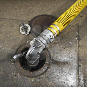 Royalty Free Photo of a Hose Carrying Fuel to Storage