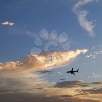 Royalty Free Photo of an Airplane Jetting Across the Sky