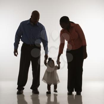 Royalty Free Photo of a Family Standing Smiling