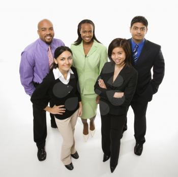 Portrait of multi-ethnic business group standing looking at viewer.