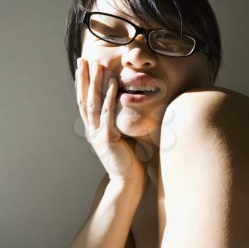Royalty Free Photo of a Head and Shoulder Portrait of a Pretty Asian Woman Smiling