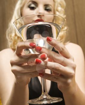Royalty Free Photo of a Woman Holding a Martini