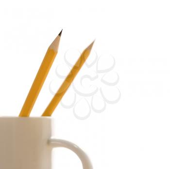 Royalty Free Photo of Pencils in a Coffee Mug With Pointed Ends Up