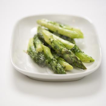 Royalty Free Photo of a Plate of Cooked Asparagus