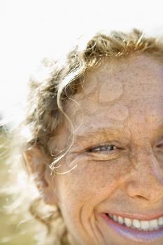 Royalty Free Photo of a Close-Up of a Woman With Wavy Hair Smiling