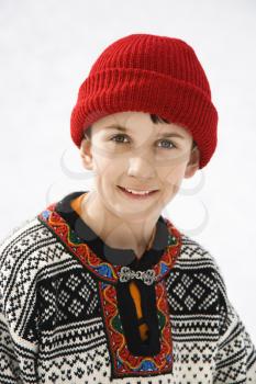 Royalty Free Photo of a Boy Wearing a Sweater Smiling