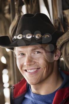 Royalty Free Photo of a Man Wearing a Cowboy Hat Smiling