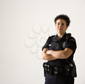 Royalty Free Photo of a Policewoman Standing With Her Arms Crossed