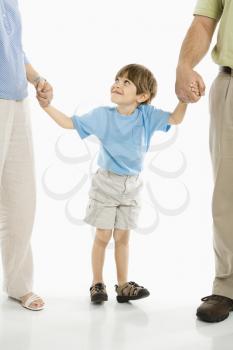 Royalty Free Photo of a Boy Holding Hands With His Parents