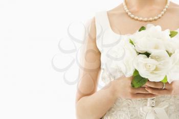 Close up shot of an Asian bride holding bouquet.