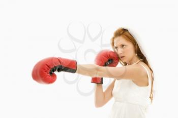 Royalty Free Photo of a Bride Wearing Boxing Gloves