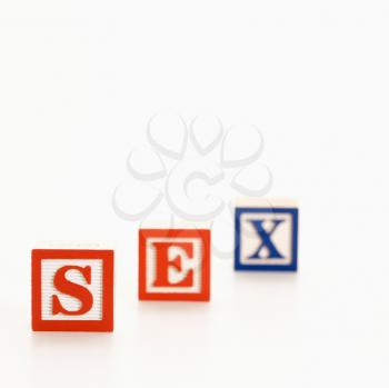 Alphabet toy building blocks spelling the word sex.