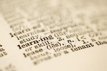 Royalty Free Photo of a Selective Focus of a Dictionary Definition for the Word Learning