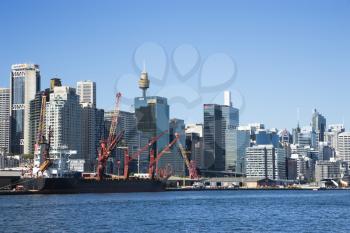 Downtown Sydney, Australia with view of cargo ship and harbour. 