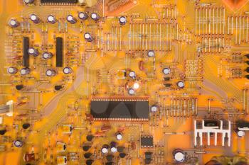 Royalty Free Photo of an Orange Circuit Board Detail