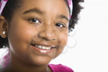 Royalty Free Photo of a Girl Wearing a Headband Smiling