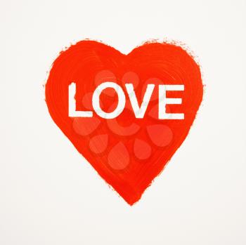 Royalty Free Photo of a Red Heart That Says Love