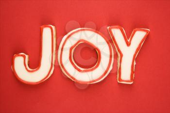 Royalty Free Photo of Sugar cookies with decorative icing that spell joy