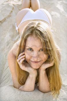 Royalty Free Photo of a Woman Lying on the Beach