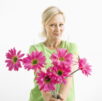 Royalty Free Photo of a Woman Holding a Bouquet of Pink Flowers