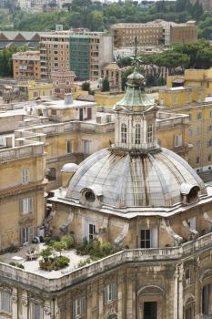 High angle view of a domed building, with an adjoining rooftop garden, in Rome. Vertical shot.