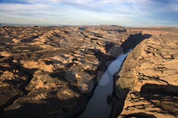 River carved through a rocky, desert landscape. Horizontal shot.