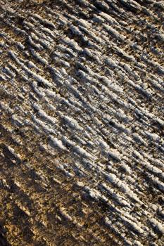 Aerial view of a rocky landscape with snow on the ground. Vertical shot.