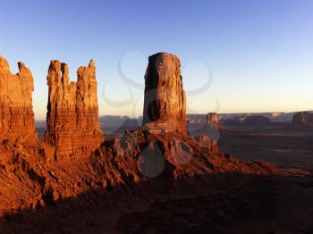 Tall rock formations in Monument National Park at sunset. Horizontal shot.