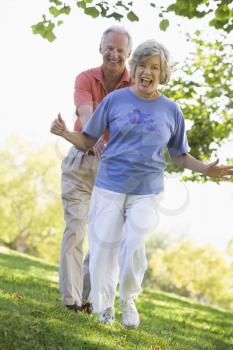 Royalty Free Photo of a Couple Walking in the Park