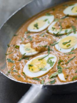Royalty Free Photo of Eggs Cooked Moghali Style in a Pan