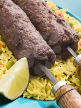 Royalty Free Photo of Lamb Mint and Garlic Sheesh Kebab With Pilau Rice