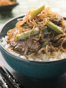 Royalty Free Photo of Sweet Soy Beef Fillet With Shirakaki Noodles on Rice with Shichimi Togarashi Pepper