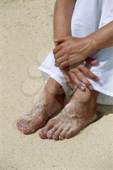 Royalty Free Photo of a Woman's Legs on the Beach