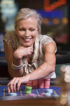 Royalty Free Photo of a Woman at a Roulette Table