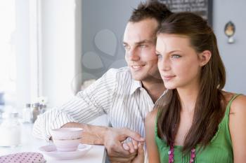 Royalty Free Photo of a Young Couple Having Tea