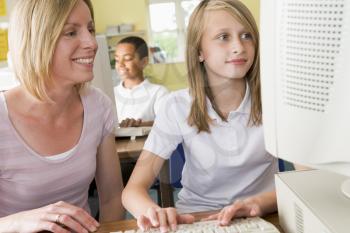 Royalty Free Photo of a Student and Teacher at a Computer Terminal